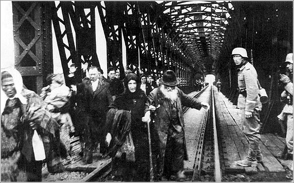 Refugees crossing the bridge over the San River in Przemysl